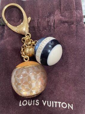 Louis Vuitton Gold-Tone Duo Spheres monogram mini lin key holder and Bag charm